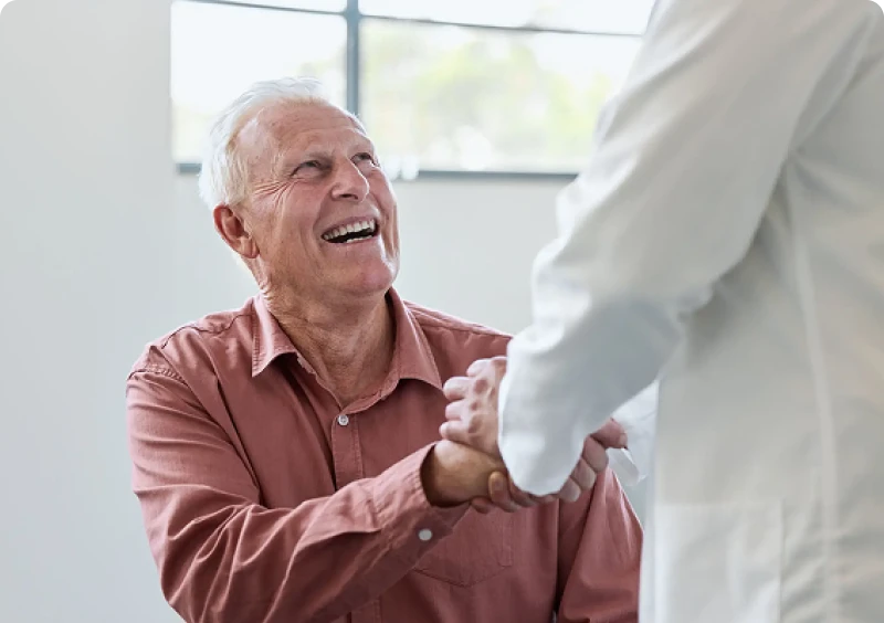 Senior patient smiling in doctor's office