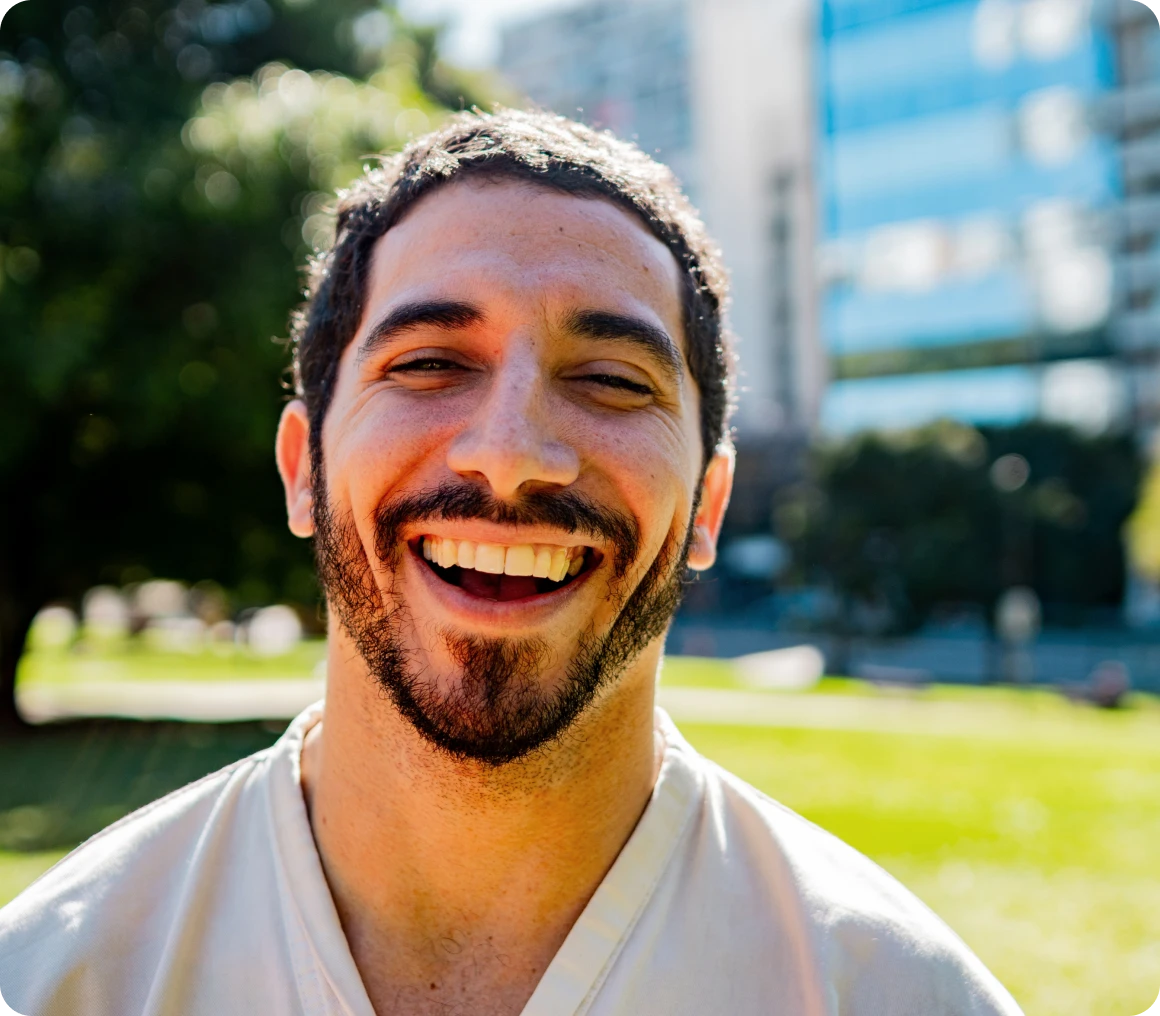 Cheerful individual with city backdrop